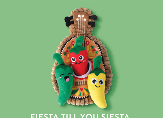 Three plush chili peppers, red, green, and yellow, on a brown guitar-shaped background