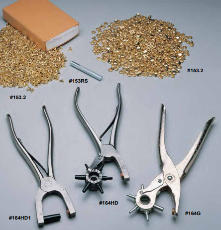 Three different hole punches, two piles of brass eyelets, and an eyelet setter