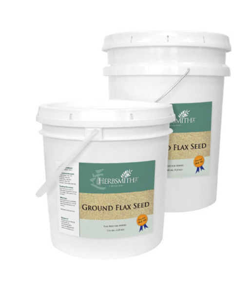 Two white plastic buckets of Herbsmith Ground Flax Seed for horses