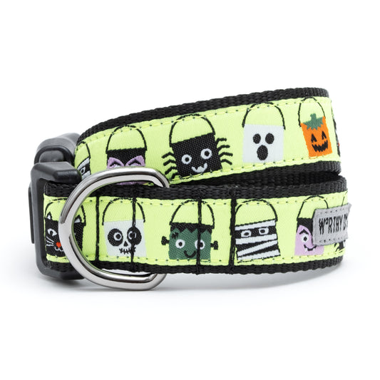 The Worthy Dog Tricks for Treats Collar with Halloween candy buckets on a lime green background