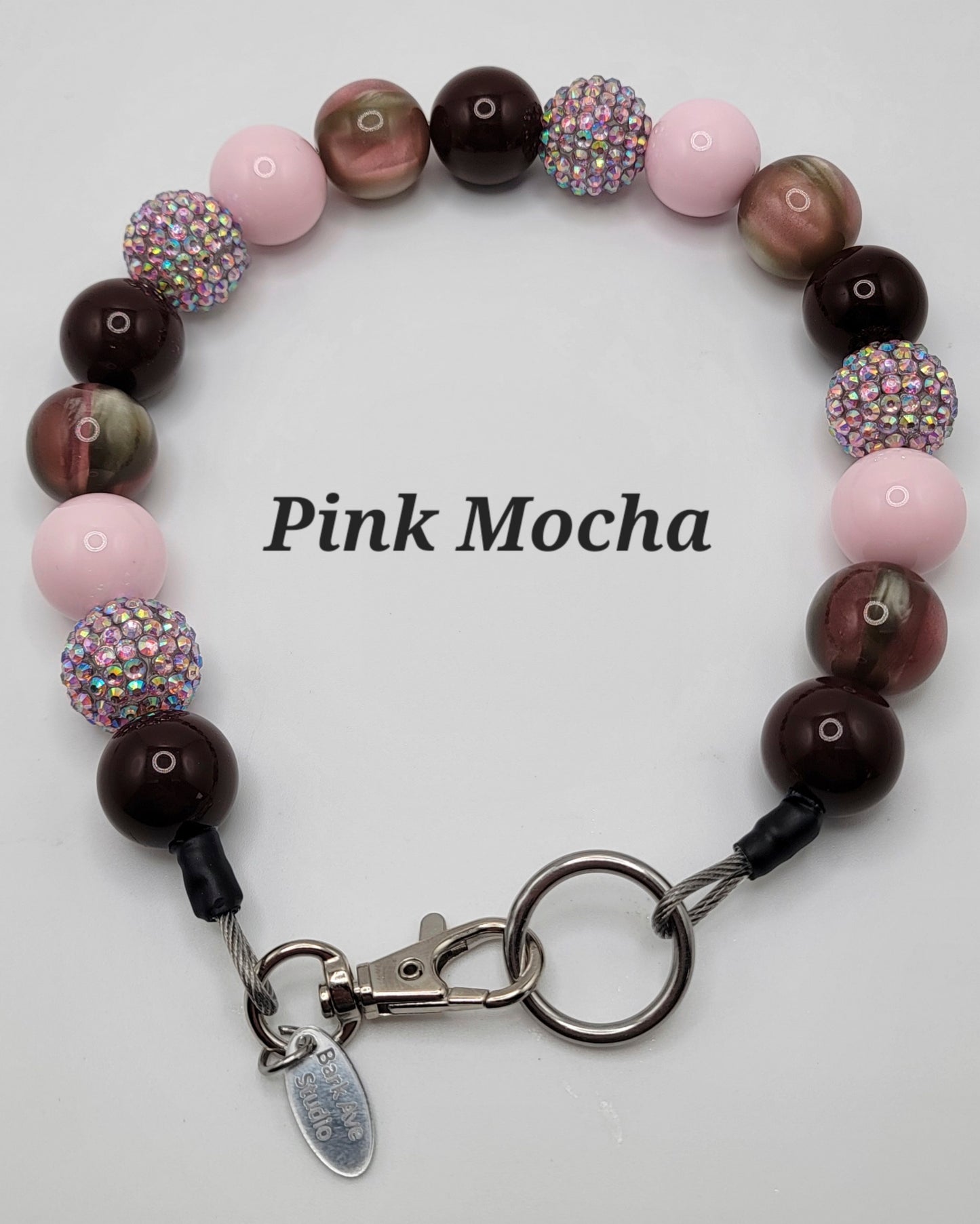 Pink Mocha beaded bracelet with pink, brown, and sparkly iridescent beads, silver clasp, and Park Ave Studio tag