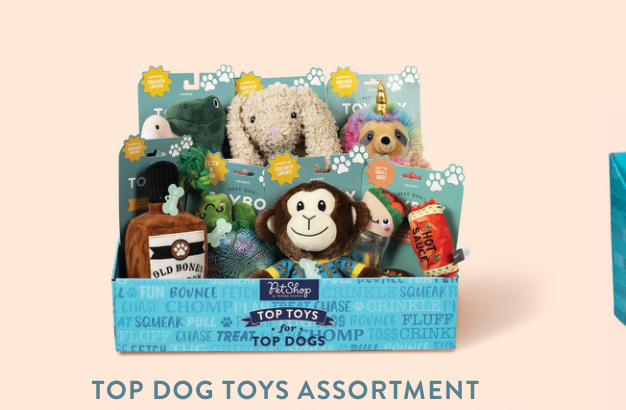 Top Dog Toys Assortment display box with various plush dog toys including a monkey, dinosaur, and unicorn