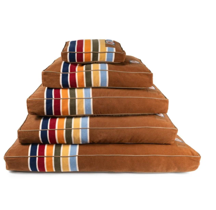Pendleton National Park Pet Napper, a stack of five brown pet beds with colorful striped accents