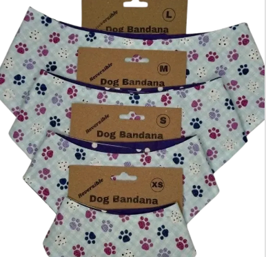 Four reversible dog bandanas in various sizes, light blue with paw prints