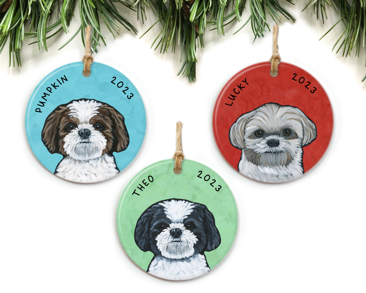 Three Shih Tzu ornaments by The Cheery Pet (Jessi McNeal) hanging from pine branches