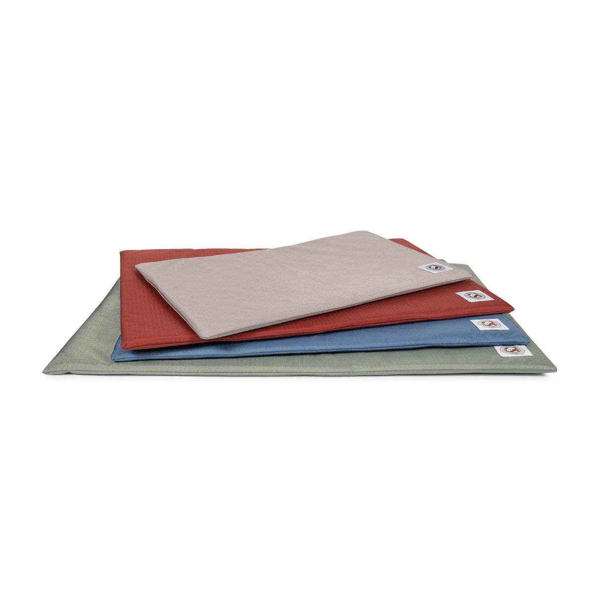 Stack of four Pendleton Carolina Brutus chew resistant comfort mats in assorted colors