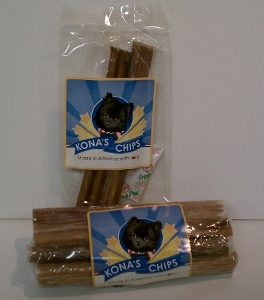 Two clear bags of Kona's Chips dog treats, each with a label featuring a black dog