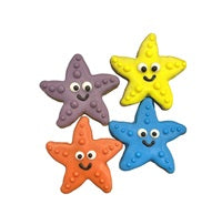 Four colorful starfish shaped cookies with smiling faces