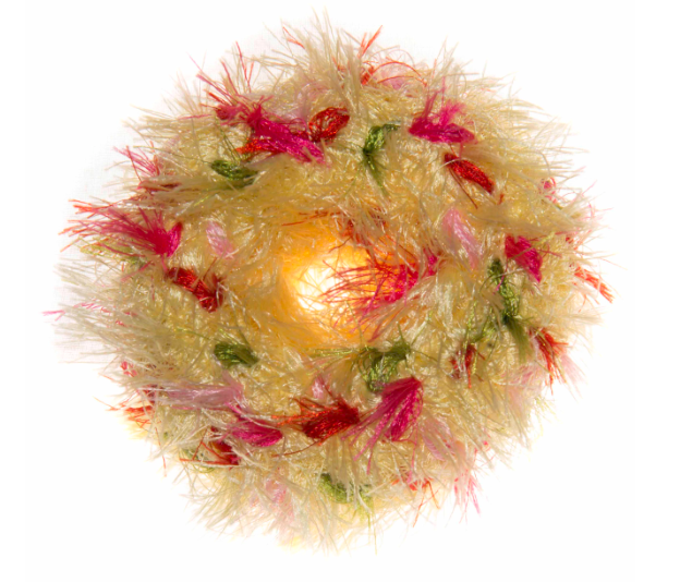Mendota Pet Oomaloo donut shaped pet toy with cream colored shaggy yarn and pink and green accents
