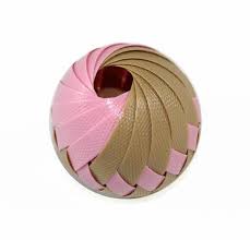 Round woven ball with pink and tan textured strips