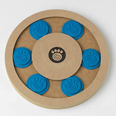 Round wooden dog puzzle with six blue paw print covers and a central paw print logo