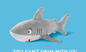 Grey shark plush toy with white belly and red mouth detail