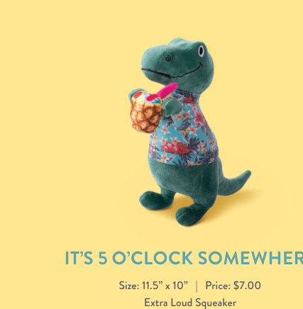 Green dinosaur plush toy wearing a Hawaiian shirt and holding a pineapple drink