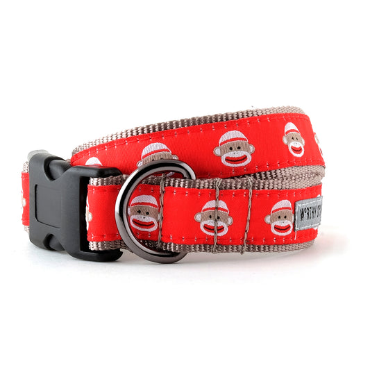 The Worthy Dog Sock Monkey Collar, red with sock monkey faces, black buckle, and metal D-ring