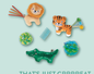 A collection of cat toys including a lion, tiger, alligator, and various balls and springs