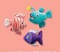 Three colorful plush fish toys, one red and white striped, one teal anglerfish, and one purple fish