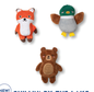 Plush toys shaped like a fox, a duck, and a bear