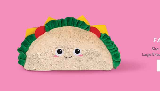 Fringe Studio Fantas Taco Large Plush Toy with a smiling face on a pink background