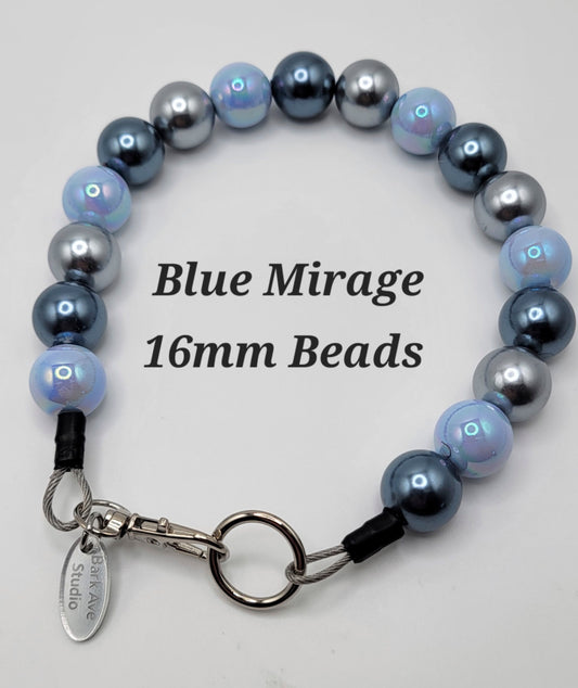 Blue Mirage 16mm Beads by Bark Ave Studio, a necklace with blue, light blue, and silver beads