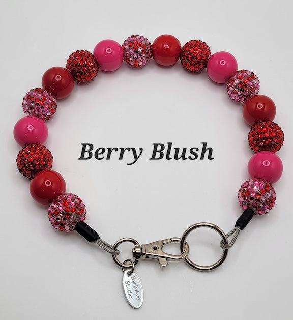 Berry Blush beaded dog collar with red and pink beads, some with rhinestones, and a silver clasp