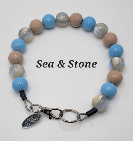 Sea & Stone beaded dog collar with blue, tan, and marbled beads, Bark Ave Studio tag