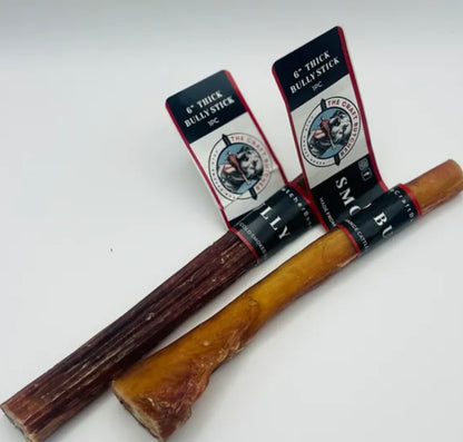 Two Smoked Bully Sticks from The Craft Butcher Bones, one dark brown and one golden brown