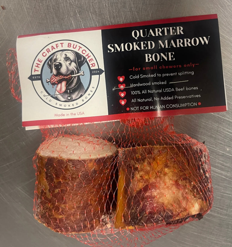 The Craft Butcher Quarter Smoked Marrow Bone dog treats in red mesh packaging