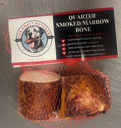 The Craft Butcher Quarter Smoked Marrow Bone dog treats in red mesh packaging