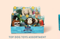 Top Dog Toys Assortment display box with various plush dog toys including a monkey, dinosaur, and unicorn