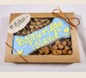 Paws Gourmet Bakery Bainbridge Island dog bone treat in a box with small treats