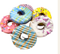 Assortment of colorful donuts with sprinkles and icing