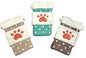 Three coffee cup shaped dog treats with paw print design