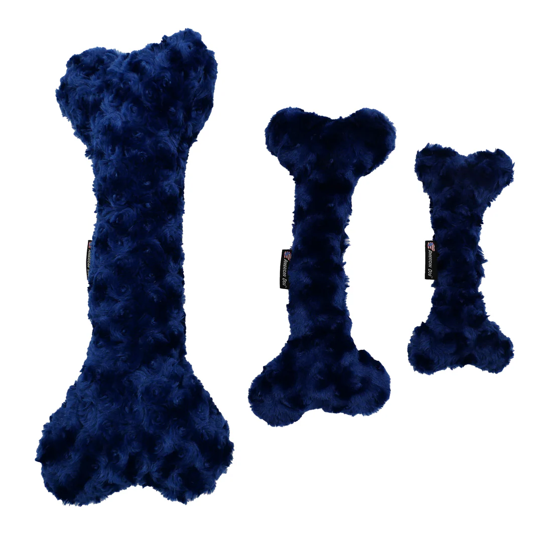 Three navy blue plush dog toys shaped like bones, in varying sizes, on a white background