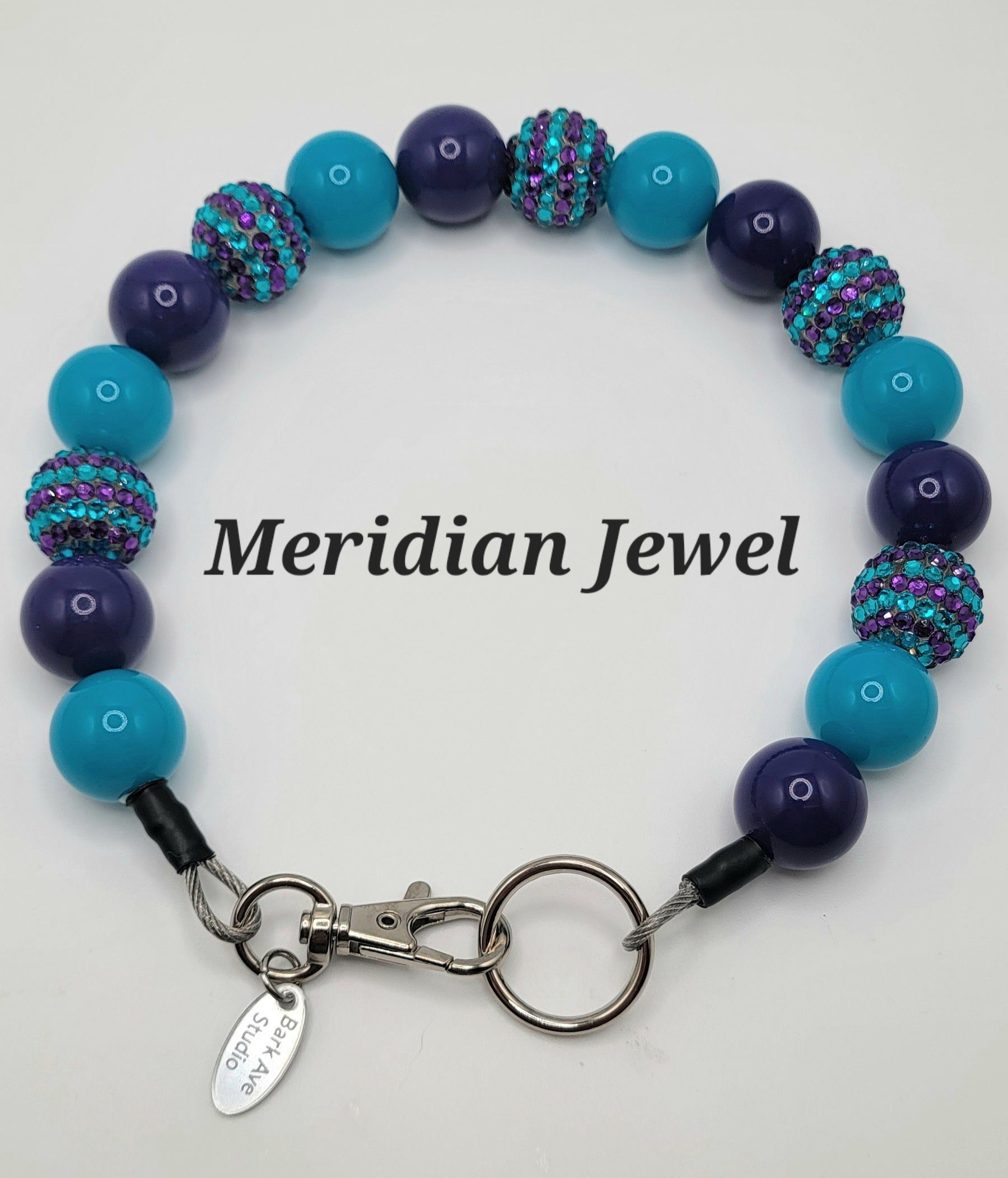 Meridian Jewel dog collar with alternating purple and teal beads, some with rhinestones, and a silver clasp