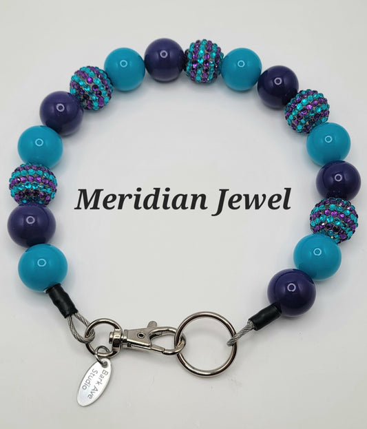 Meridian Jewel dog collar with alternating purple and teal beads, some with rhinestones, and a silver clasp