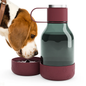 Beagle dog drinking water from a burgundy travel water bottle with a detachable bowl