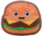 A plush toy shaped like a hamburger with a smiling face