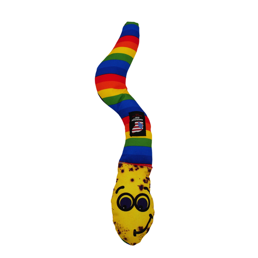 American Dog banana dog toy with a rainbow striped body and a yellow banana head with a smiling face