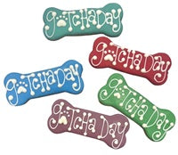 Five bone-shaped dog treats in teal, red, blue, purple, and green, each decorated with Gotcha Day