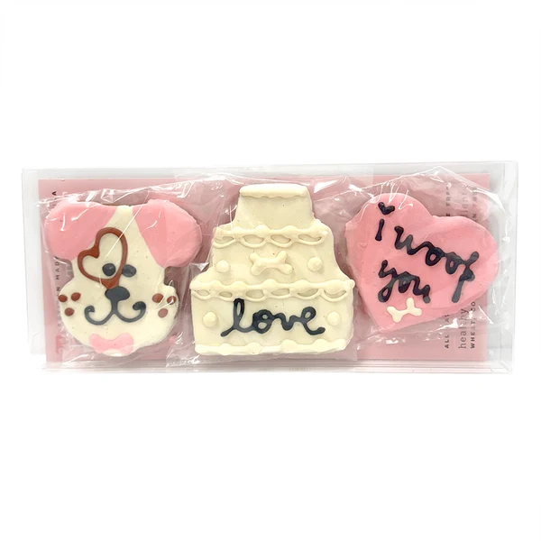 Bubba Rose Biscuit Co With Love dog treats shaped like a puppy a cake and a heart in clear packaging