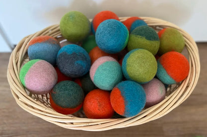Whiskers n Paws felt balls in a woven basket